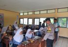 Bhabinkamtibmas Polsek Nyalindung Polres Sukabumi  Monitoring Kegiatan Police Goes to School dan Pembagian Makan Bergizi di SMPN 1 Nyalindung